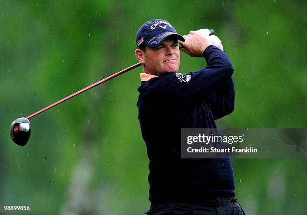 David Drysdale of Scotland plays his tee shot on the fifth hole during the second round of the BMW Italian Open at Royal Park I Roveri on May 7, 2010...