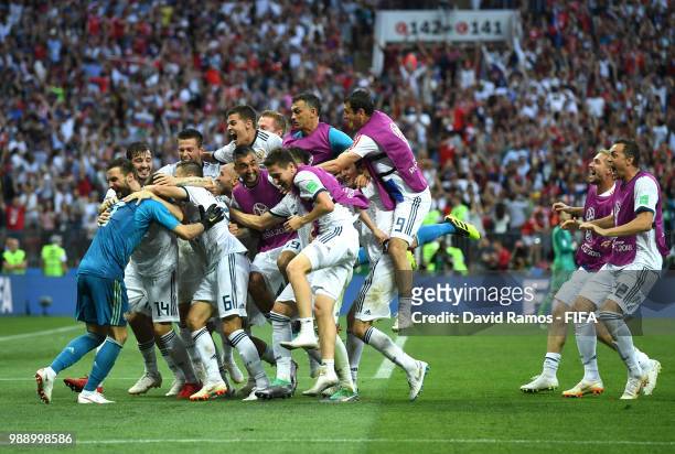 Akinfeev of Russia is celebrated by team mates following the penalty shoot out during the 2018 FIFA World Cup Russia Round of 16 match between Spain...