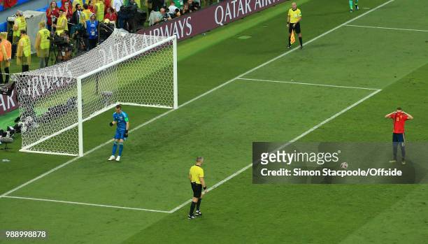 Dejected Koke of Spain hides behind his shirt after Russia goalkeeper Igor Akinfeev saves his penalty during the 2018 FIFA World Cup Russia Round of...