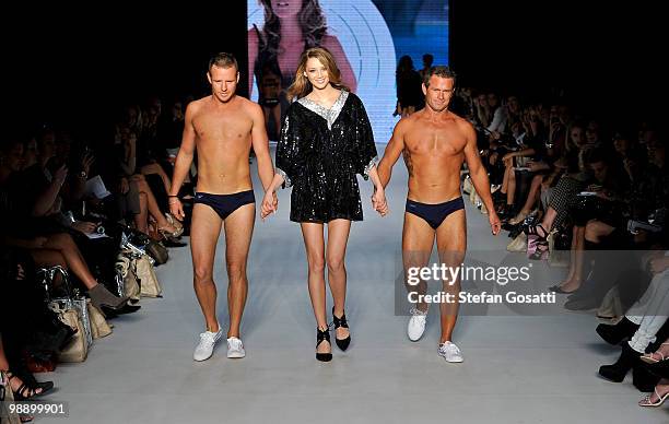 Model kisses a Bondi Rescue lifeguard at the finale of the Lisa Maree show during the Swimwear Fashion Week At RAFW collection show on the fifth and...