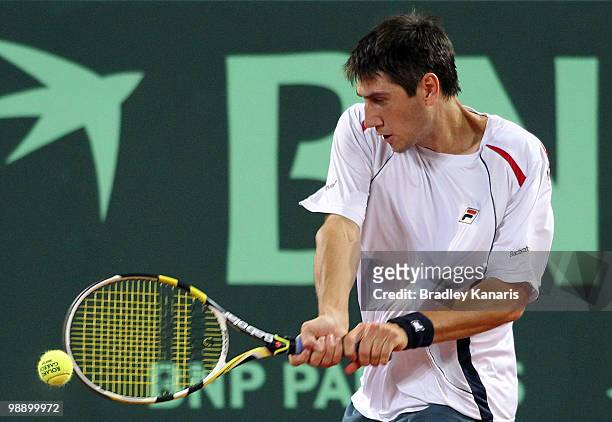 Carsten Ball of Australia plays a forehand during his match against Yuichi Sugita of Japan during the match between Australia and Japan on day one of...
