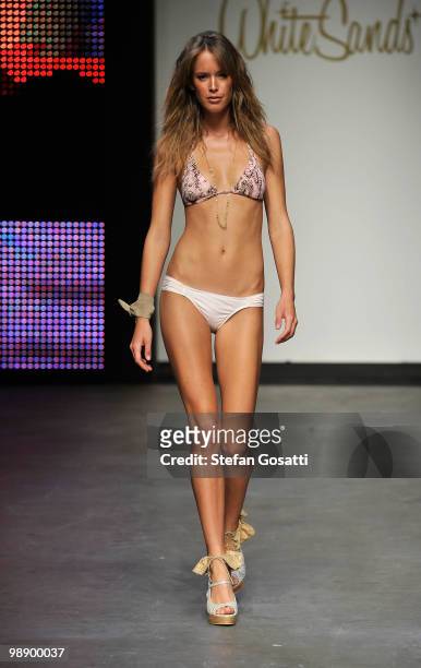Model showcases designs on the catwalk during the White Sands collection show on the fifth and final day of Rosemount Australian Fashion Week...