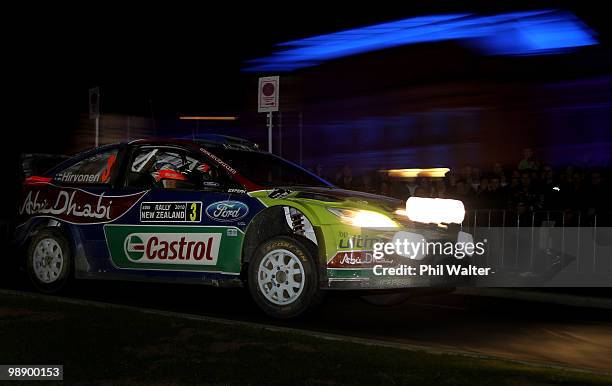 Mikko Hiroven and co-driver Jarmo Lehtinen of Finland drive their Ford Focus RS WRC past the Auckland Museum during stage nine of the WRC Rally of...