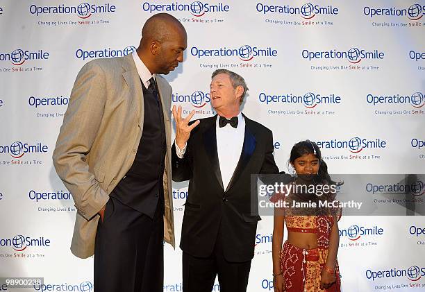 Former NBA player John Salley, Operation Smile Co-founder Dr. Bill Magee, Meena and speak on the red carpet during the Operation Smile Annual Gala at...