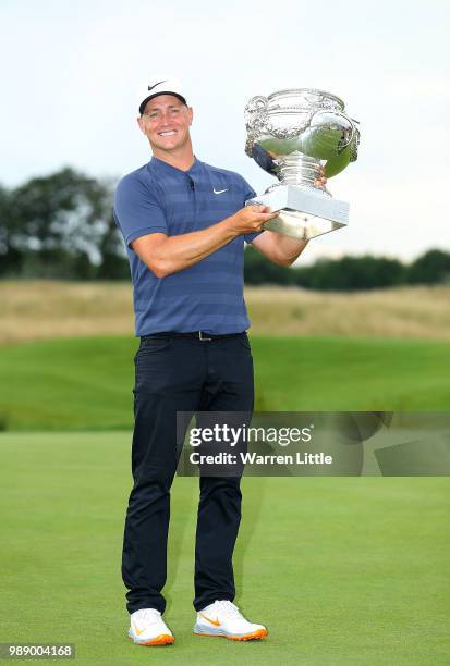 Alex Noren of Sweden celebrates with the trophy after winning the HNA Open de France at Le Golf National on July 1, 2018 in Paris, France.