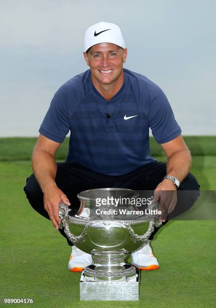 Alex Noren of Sweden celebrates with the trophy after winning the HNA Open de France at Le Golf National on July 1, 2018 in Paris, France.