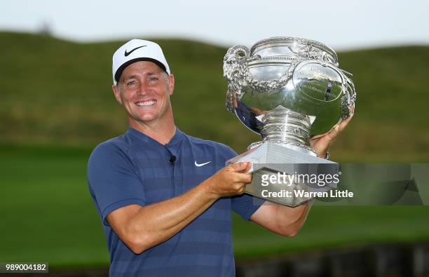 Alex Noren of Sweden celebrates with the trophy after winning the HNA Open de France at Le Golf National on July 1, 2018 in Paris, France.