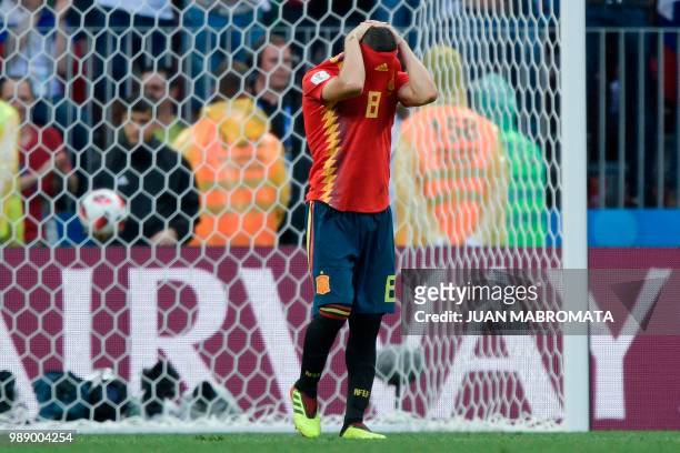 Spain's midfielder Koke reacts after missing his shot during the penalty shootout of the Russia 2018 World Cup round of 16 football match between...