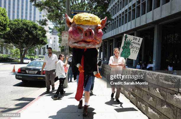 Demonstrators participates in the Families Belong Together - Freedom For Immigrants March at Los Angeles City Hall on June 30, 2018 in Los Angeles,...