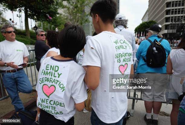 Demonstrators participates in the Families Belong Together - Freedom For Immigrants March at Los Angeles City Hall on June 30, 2018 in Los Angeles,...
