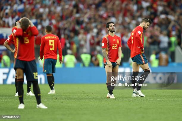 Spain players look dejected following the 2018 FIFA World Cup Russia Round of 16 match between Spain and Russia at Luzhniki Stadium on July 1, 2018...