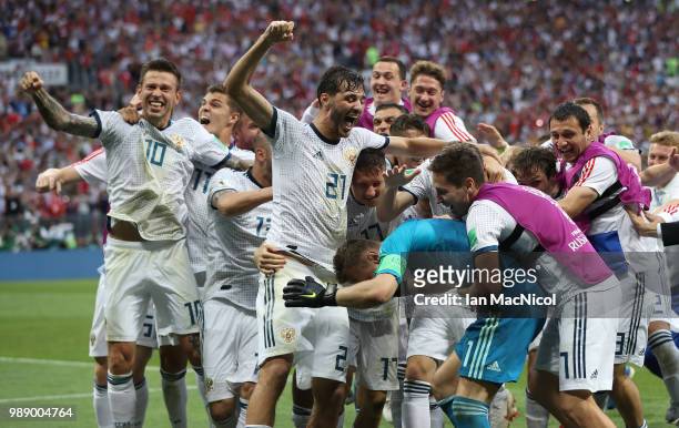 The Russia team celebrate with goalkeeper Igor Akinfeev of Russia during the 2018 FIFA World Cup Russia Round of 16 match between Spain and Russia at...
