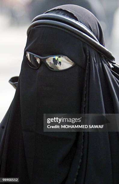 Shiite Muslim pilgrim walks on the raod between the holy cities of Najaf and Karbala, 110 kms south of the Iraqi capital Baghdad, on January 29, 2010...