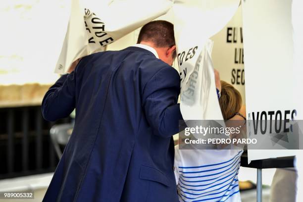 Mexico's presidential candidate Ricardo Anaya for the "Mexico al Frente" coalition party, prepares to cast his vote during general elections, in...