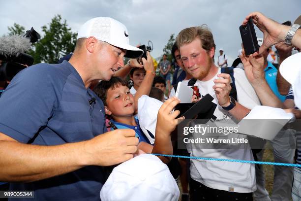 Alex Noren of Sweden signs autographs after winning the HNA Open de France at Le Golf National on July 1, 2018 in Paris, France.