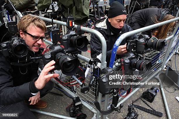 Press photographers set up their remote cameras as they wait for a glimpse of British Prime Minister Gordon Brown who arrived back at 10 Downing...