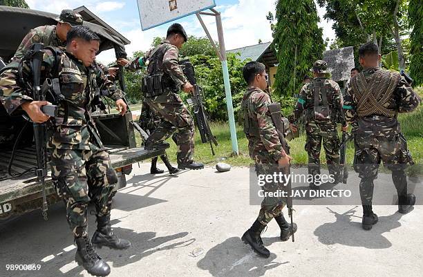 Soldiers are deployed in towns of Maguindnao province in the southern Philippines on May 7, 2010 three days before national elections. Security...