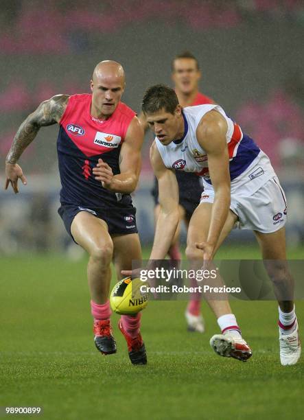 Ryan Hargrave of the Bulldogs gathers the ball during the round seven AFL match between the Melbourne Demons and the Western Bulldogs at Melbourne...