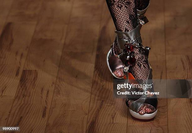 Model walks the runway wearing Gustavo Helguera jewelry and accessories Autumn/Winter 2009 during Mercedes-Benz Fashion Mexico 2009 at Antara Polanco...