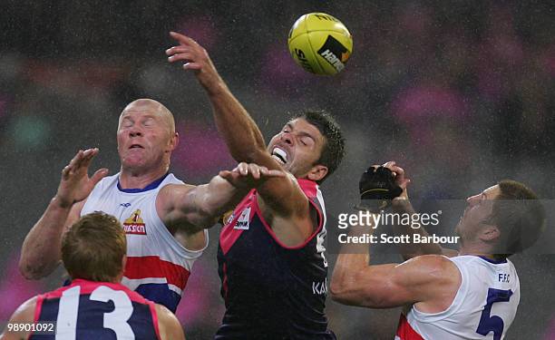 Mark Jamar of the Demons and Barry Hall of the Bulldogs compete for the ball during the round seven AFL match between the Melbourne Demons and the...
