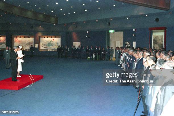 Crown Prince Akihito addresses while Crown Princess Michiko and attendees listen during their visit to the Peace Memorial Hall at Okinawa Peace...