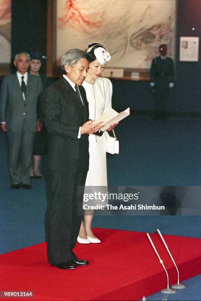 Crown Prince Akihito addresses while Crown Princess Michiko listens during their visit to the Peace Memorial Hall at Okinawa Peace Memorial Park on...