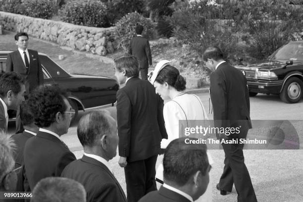 Crown Prince Akihito and Crown Princess Michiko are seen after praying for the victims of the Battle of Okinawa at Okinawa Peace Memorial Park on...