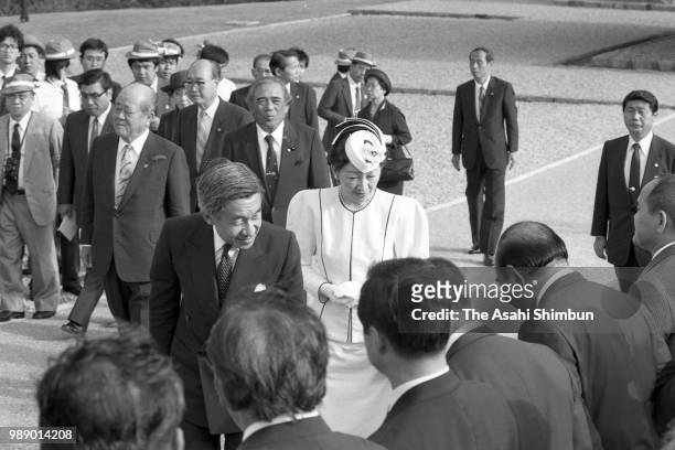 Crown Prince Akihito and Crown Princess Michiko are seen after praying for the victims of the Battle of Okinawa at Okinawa Peace Memorial Park on...