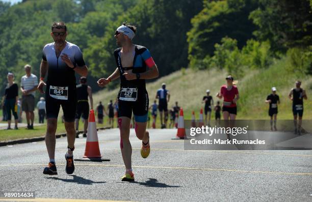 Athletes compete in the run leg inside Holyrood Park during the IRONMAN 70.3 Edinburgh Triathlon on July 1, 2018 in Edinburgh, Scotland.