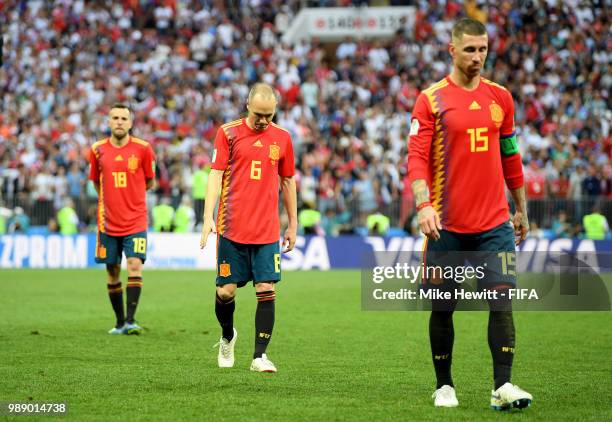 Jordi Alba,Andres Iniesta and Sergio Ramos of Spain look dejected following the 2018 FIFA World Cup Russia Round of 16 match between Spain and Russia...