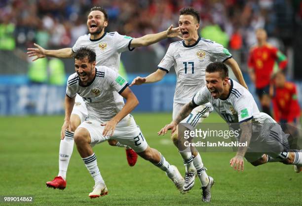 Aleksandr Erokhin of Russia celebrates when they win the penalty shoot out during the 2018 FIFA World Cup Russia Round of 16 match between Spain and...