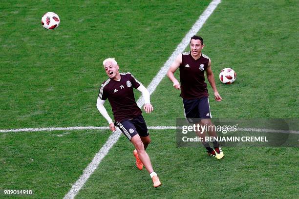 Mexico's forward Javier Hernandez and midfielder Andres Guardado take part to a training session at the Samara Arena stadium on the eve of the Russia...