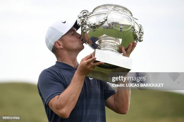 Swedish golfer Alex Noren kisses the trophy after winning the HNA Open de France, as part of the European Tour 2018, at the Saint-Quentin-en-Yvelines...