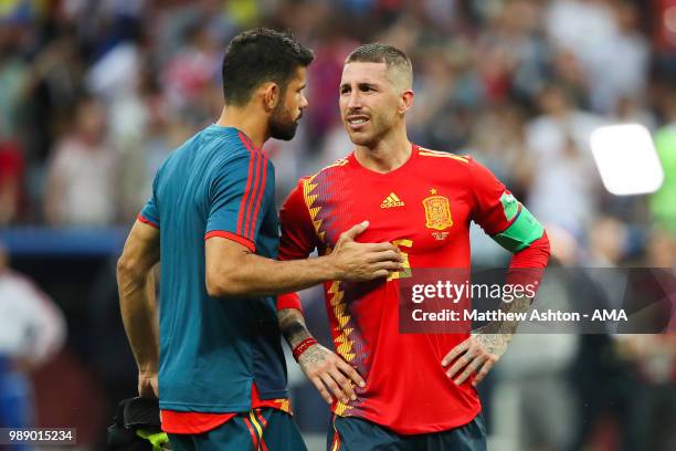 Sergio Ramos of Spain is consoled by Diego Costa of Spain after their team were eliminated during a penalty shootout during the 2018 FIFA World Cup...