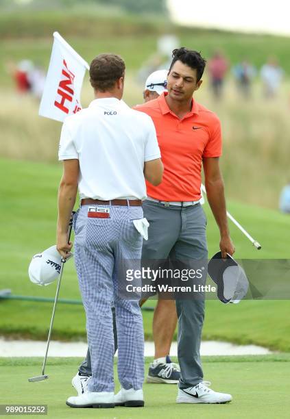 Julian Suri and Justin Thomas of The USA shake hands following their round on day four of the HNA Open de France at Le Golf National on July 1, 2018...