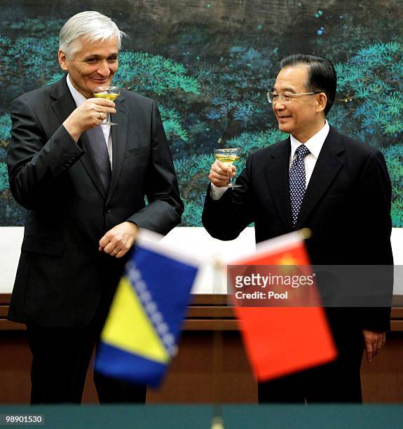 China's Premier Wen Jiabao toasts with Bosnia's Prime Minister Nikola Spiric during a signing ceremony during a meeting at the Great Hall of the...
