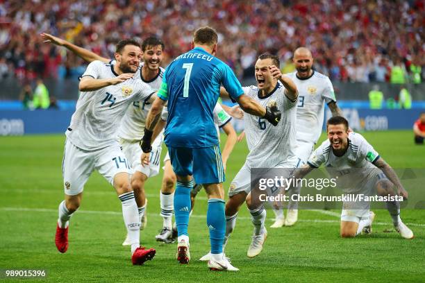 Igor Akinfeev of Russia is congratulated by his team-mates after the penalty shoot-out following the 2018 FIFA World Cup Russia Round of 16 match...