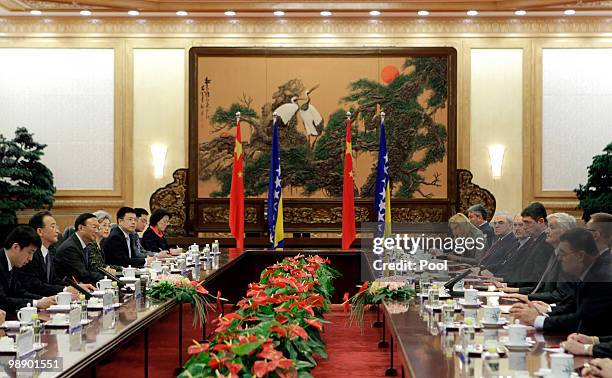 China's Premier Wen Jiabao talks with Bosnia's Prime Minister Nikola Spiric during a meeting at the Great Hall of the People on May 7, 2010 in...