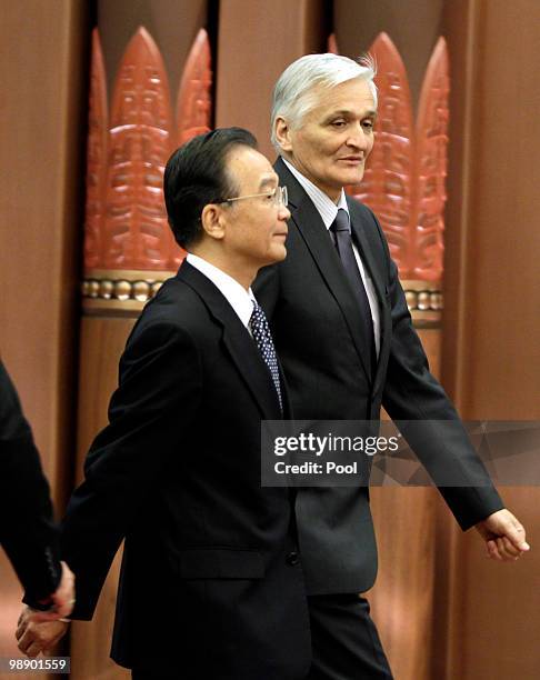 China's Premier Wen Jiabao and Bosnia's Prime Minister Nikola Spiric arrive for a signing ceremony at the Great Hall of the People on May 7, 2010 in...