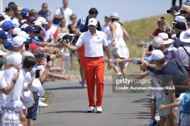 Sergio Garcia of Spain reacts as he arrives on the first tee during The Open Qualifying Series part of the HNA Open de France at Le Golf National on...