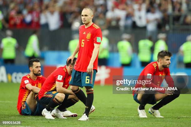 Andres Iniesta of Spain and his team-mates look dejected after their team were eliminated during a penalty shootout during the 2018 FIFA World Cup...