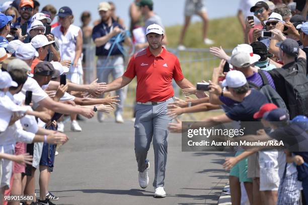 Jon Rahm of Spain reacts as he arrives on the first tee during The Open Qualifying Series part of the HNA Open de France at Le Golf National on July...