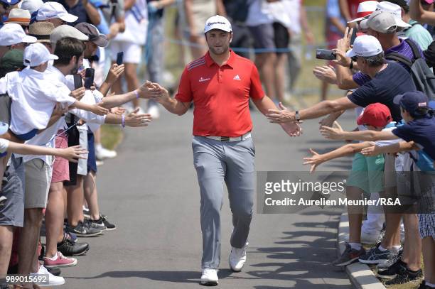 Jon Rahm of Spain reacts as he arrives on the first tee during The Open Qualifying Series part of the HNA Open de France at Le Golf National on July...