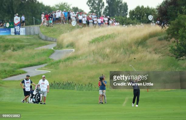 Alex Noren of Sweden plays his second shot on the 18th hole during day four of the HNA Open de France at Le Golf National on July 1, 2018 in Paris,...