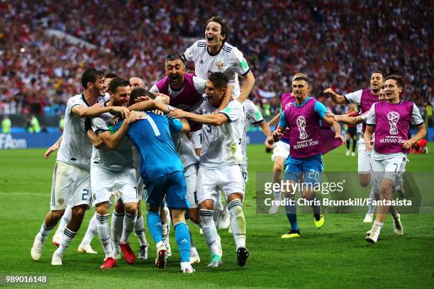 Igor Akinfeev of Russia is congratulated by his team-mates after the penalty shoot-out following the 2018 FIFA World Cup Russia Round of 16 match...