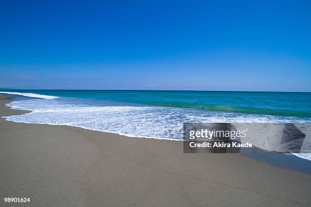 waves crashing on beach, pacific ocean, japan - atsumi stock pictures, royalty-free photos & images