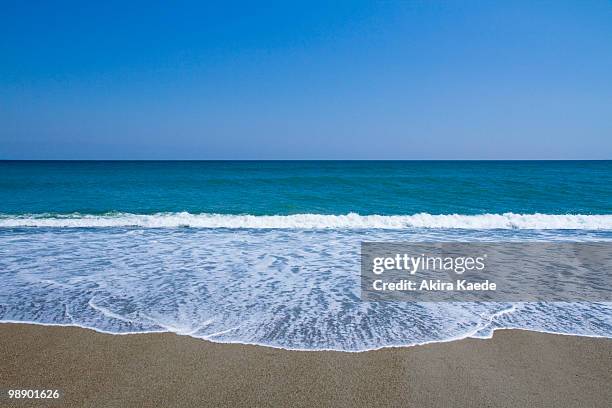 waves crashing on beach, pacific ocean, japan - atsumi stock pictures, royalty-free photos & images