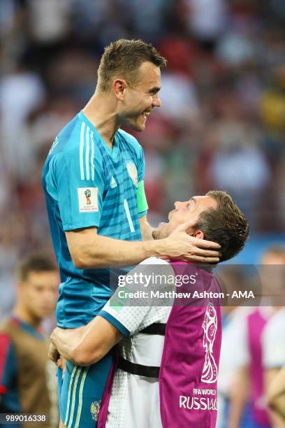 Igor Akinfeev of Russia celebrates after his team's victory in a penalty shootout during the 2018 FIFA World Cup Russia Round of 16 match between...