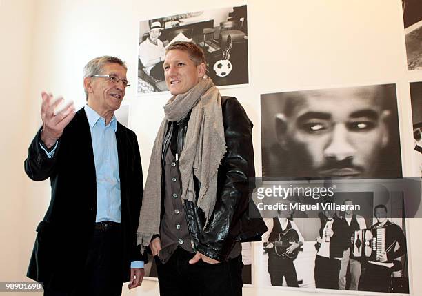 Gerd Strehle and German football player Bastian Schweinsteiger attend the Strenesse book presentation 'Die Spieler' by German photographer Ellen von...