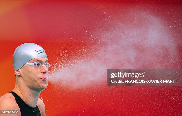 Brazil's Cesar Cielo Filho prepares to compete in the men's 50m freestyle swimming semifinal at the National Aquatics Center during the 2008 Beijing...